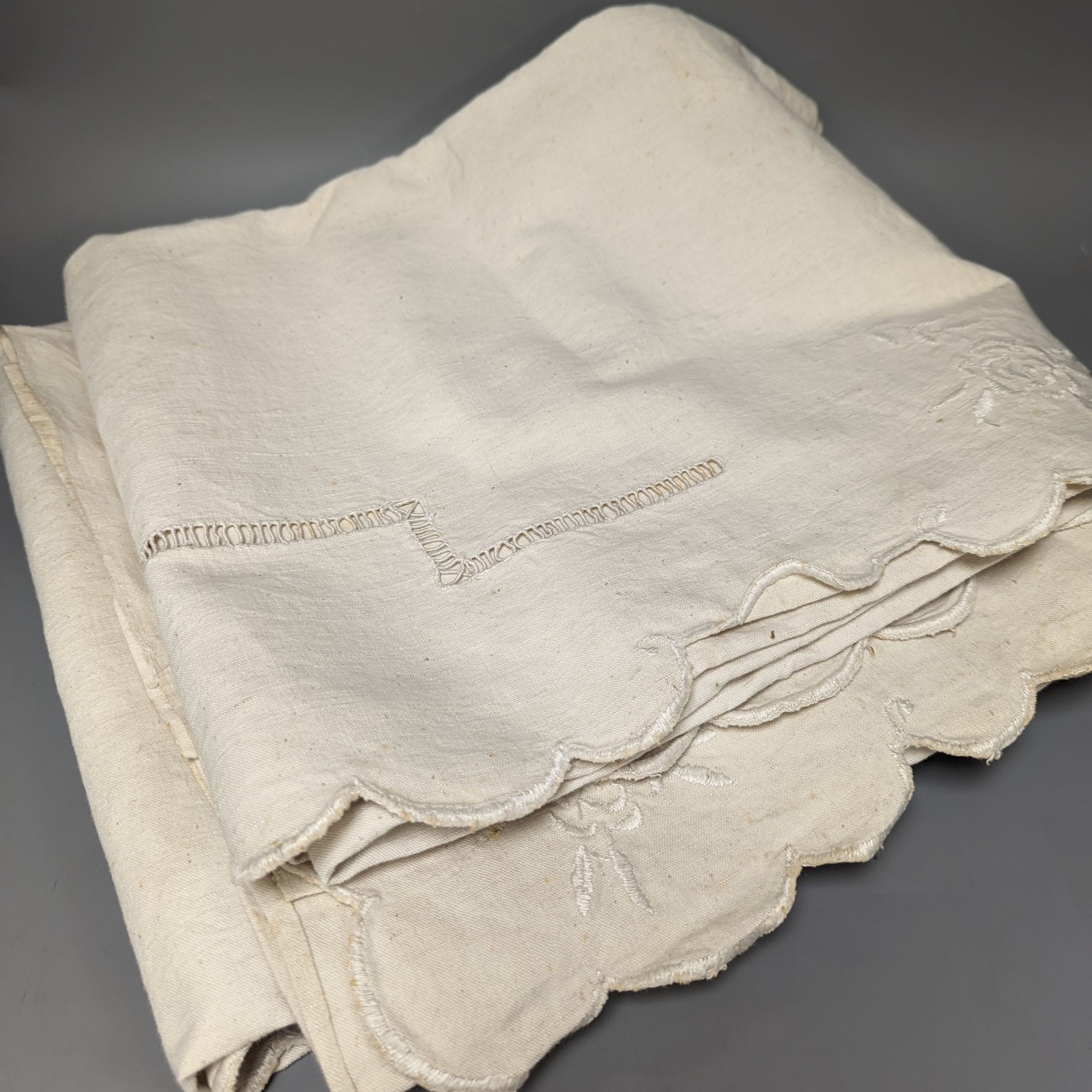 Four embroidered French provincial coarse linen sheets and three plain sheets.